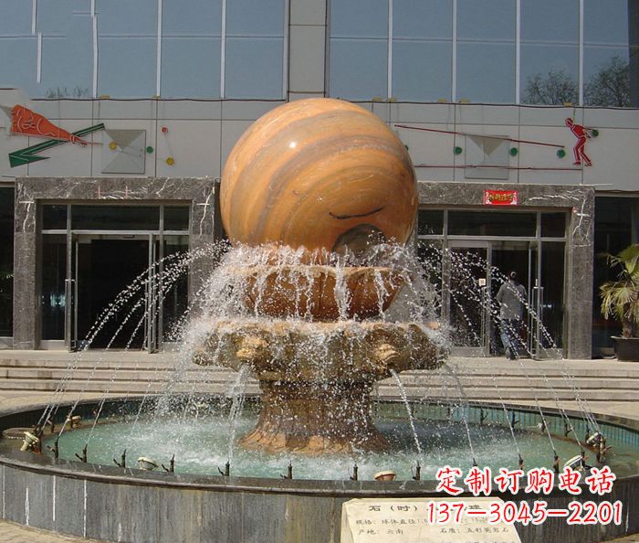 保定石来运转球晚霞红风水球石雕